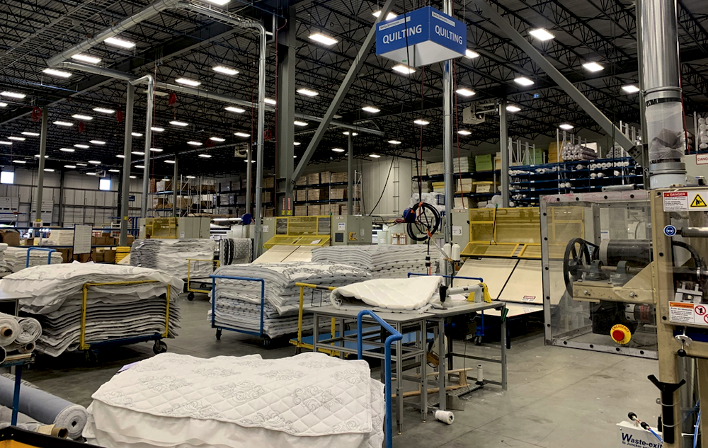 At its booth at Interzum Cologne in May, Gribetz displayed the Waste-Exit waste handling system and a material handling system from Eton Systems. In the photo on the right, the Waste-Exit system is set up in a mattress manufacturer’s quilting area.