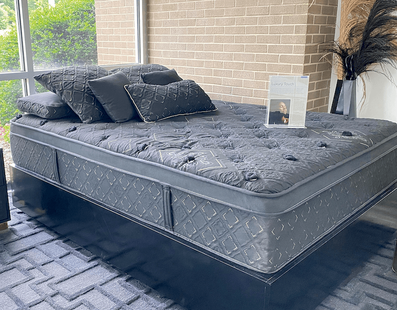 A stretch woven luxury touch fabric covers a mattress just inside the entrance of BekaertDeslee.