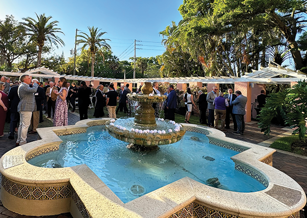 Attendees caught up after a full day.